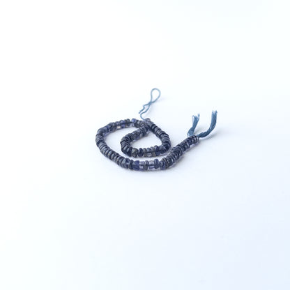 High‑quality Iolite smooth wheel beads in 4.3–4.7mm size offering clarity and shine for artisan jewellery projects.