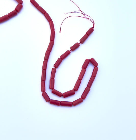 Close-up of natural gemstone beads featuring Italian Coral in 3.5mm and 4mm sizes.