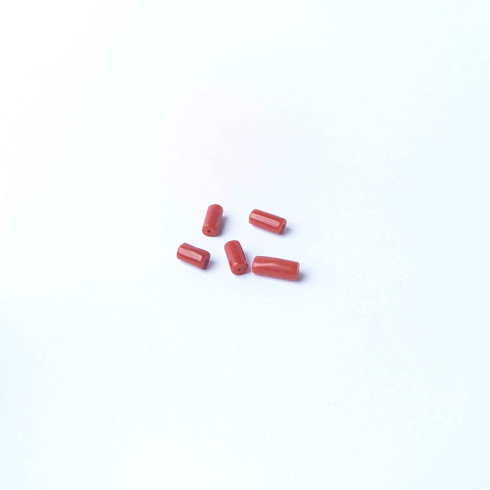 Genuine Italian Coral gemstone beads showcasing elegant colour and shine, perfect for premium jewellery design projects.