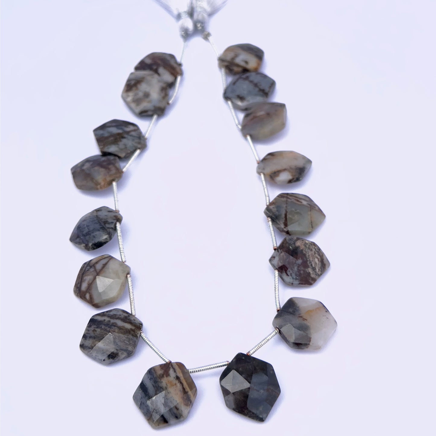 Stone beads in hexagon‑cut Jasper displayed in a neat layout for jewellery design inspiration.