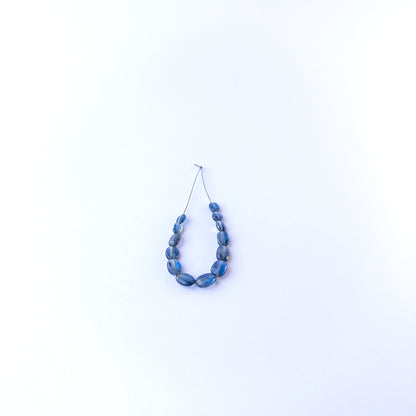 Kyanite smooth oval gemstone beads in 4.7–6.2mm sizes, showcasing deep blue tones for handmade jewellery designs.