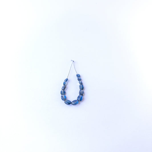Kyanite smooth oval gemstone beads in 4.7–6.2mm sizes, showcasing deep blue tones for handmade jewellery designs.