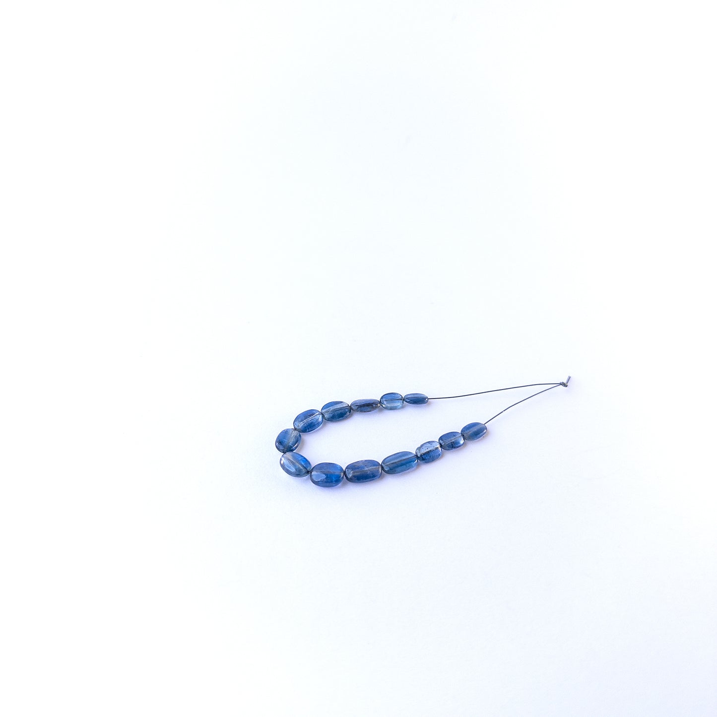Genuine kyanite stone beads with smooth oval shaping, ideal for DIY jewellery and artisan gemstone beadwork.