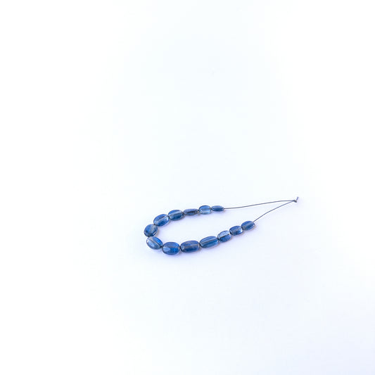 Genuine kyanite stone beads with smooth oval shaping, ideal for DIY jewellery and artisan gemstone beadwork.