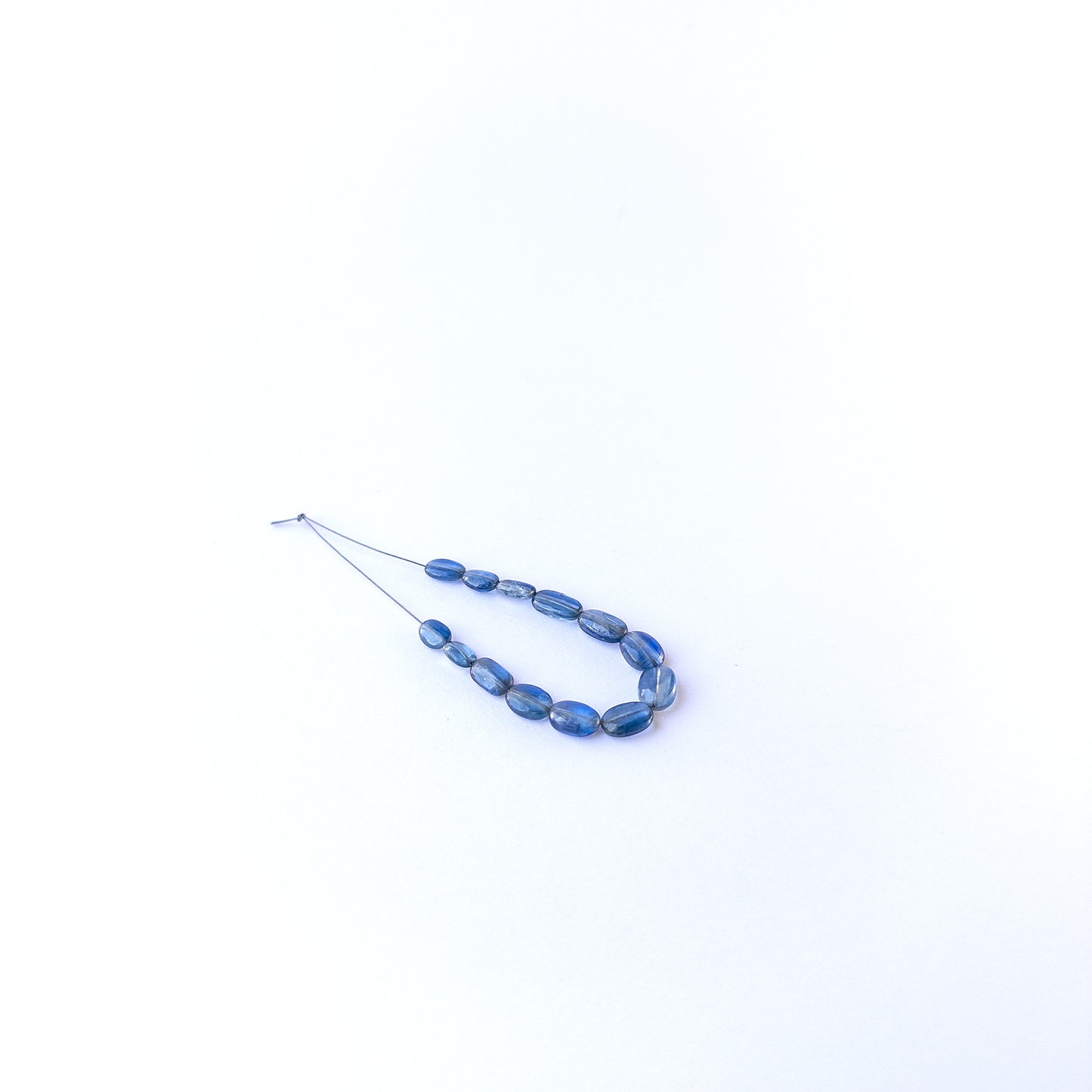 Authentic kyanite gemstone beads featuring rich blue colour and polished oval finish for premium jewellery.