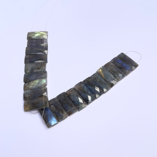 labradorite faceted rectangle gemstone beads on white background.