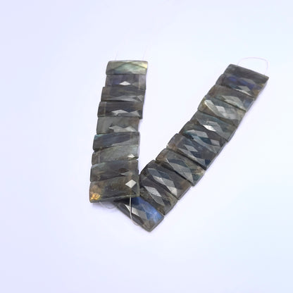 Stone beads in Labradorite finish laid flat to highlight their 19–21mm size and cut.