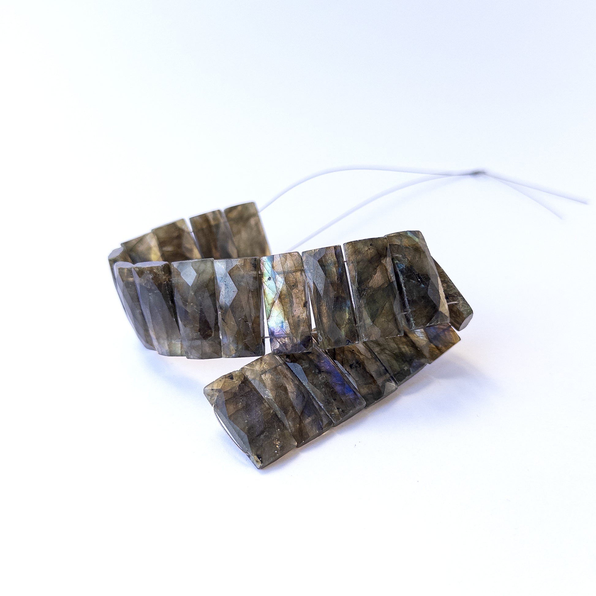 Handmade jewellery components with natural labradorite faceted rectangle beads arranged in a 20‑piece set.