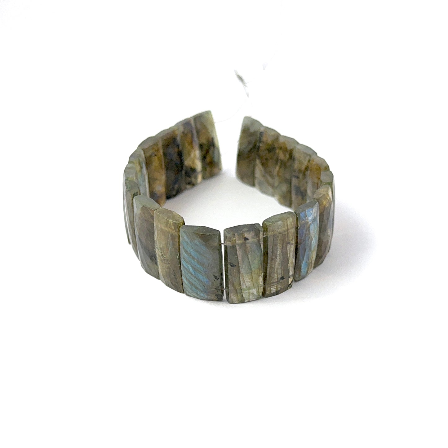Faceted rectangle Labradorite stone beads arranged neatly, highlighting their colour play and handmade jewellery component quality.