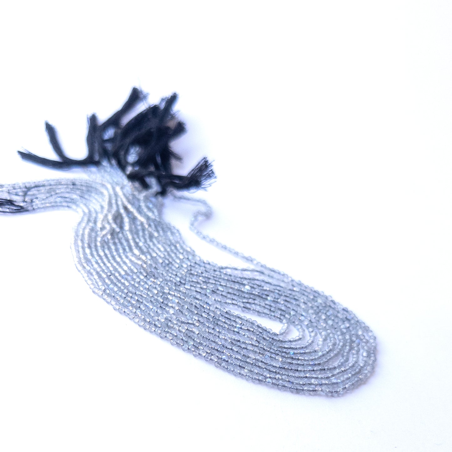 Genuine Labradorite gemstone beads in faceted rondelle cut, displaying polish, texture, and blue flash.