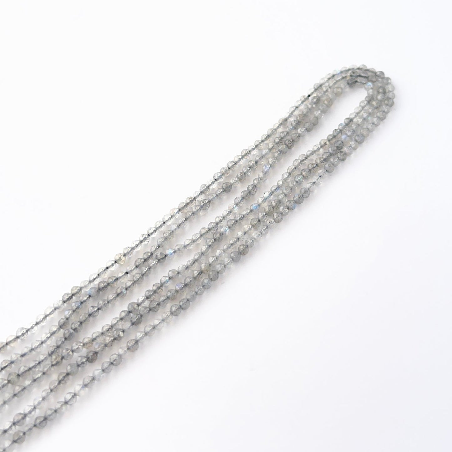 Close view of Labradorite faceted rondelles showing cut, clarity and premium gemstone quality.