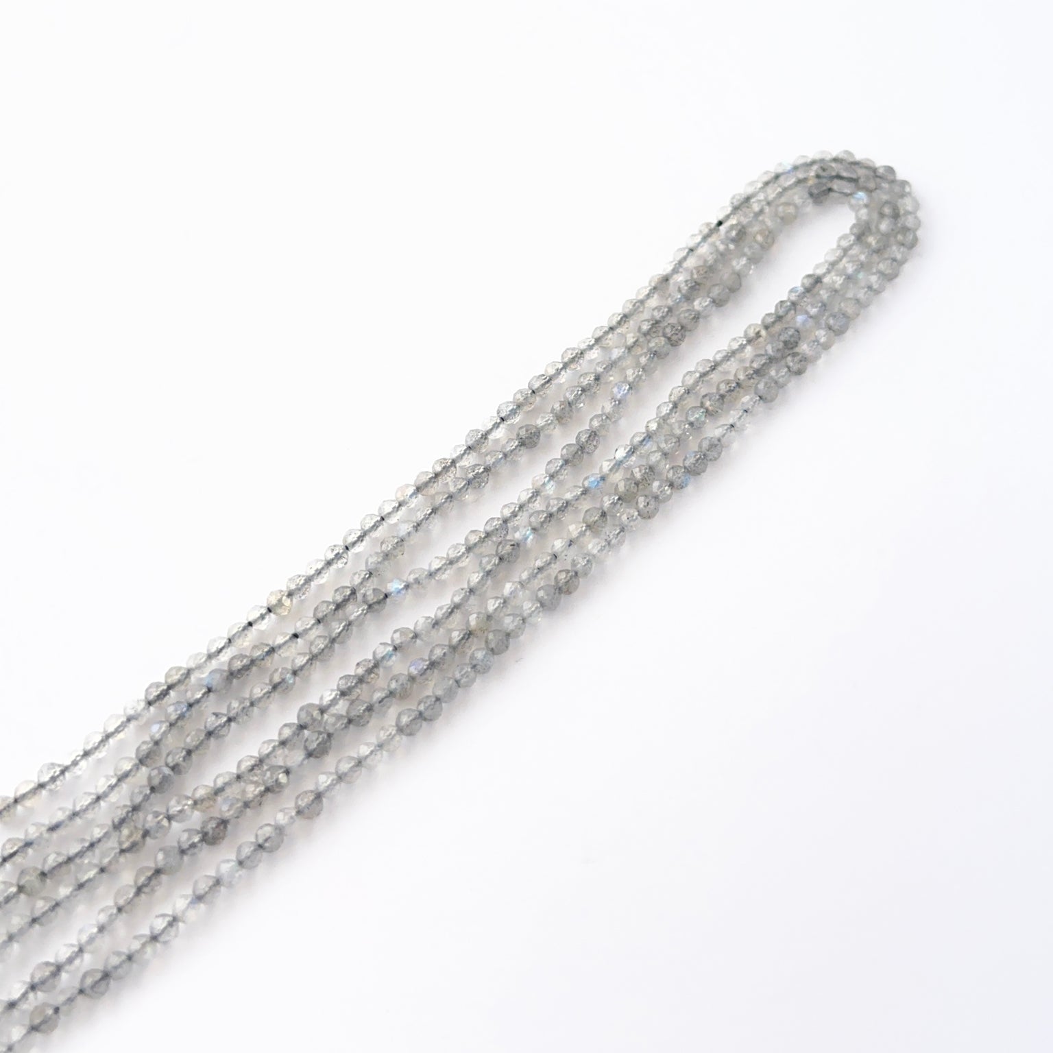 Close view of Labradorite faceted rondelles showing cut, clarity and premium gemstone quality.