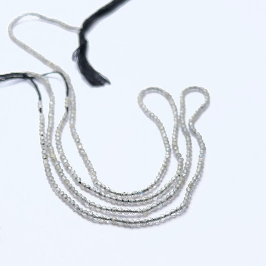 Close‑up of Green Opal stone beads in faceted rondelle cut, highlighting gentle shimmer for handmade jewellery components.