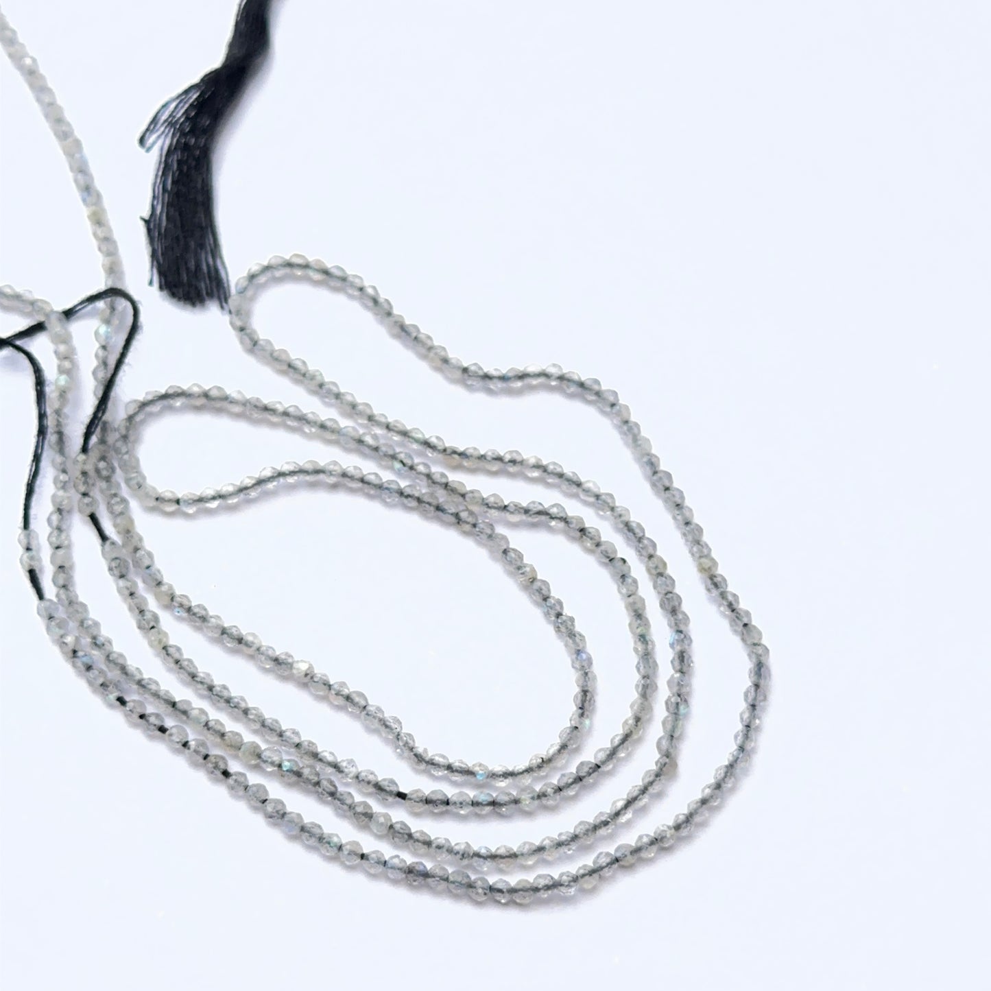 Soft‑hued Green Opal stone beads in faceted rondelle cut, displaying polished sparkle for jewellery designers.