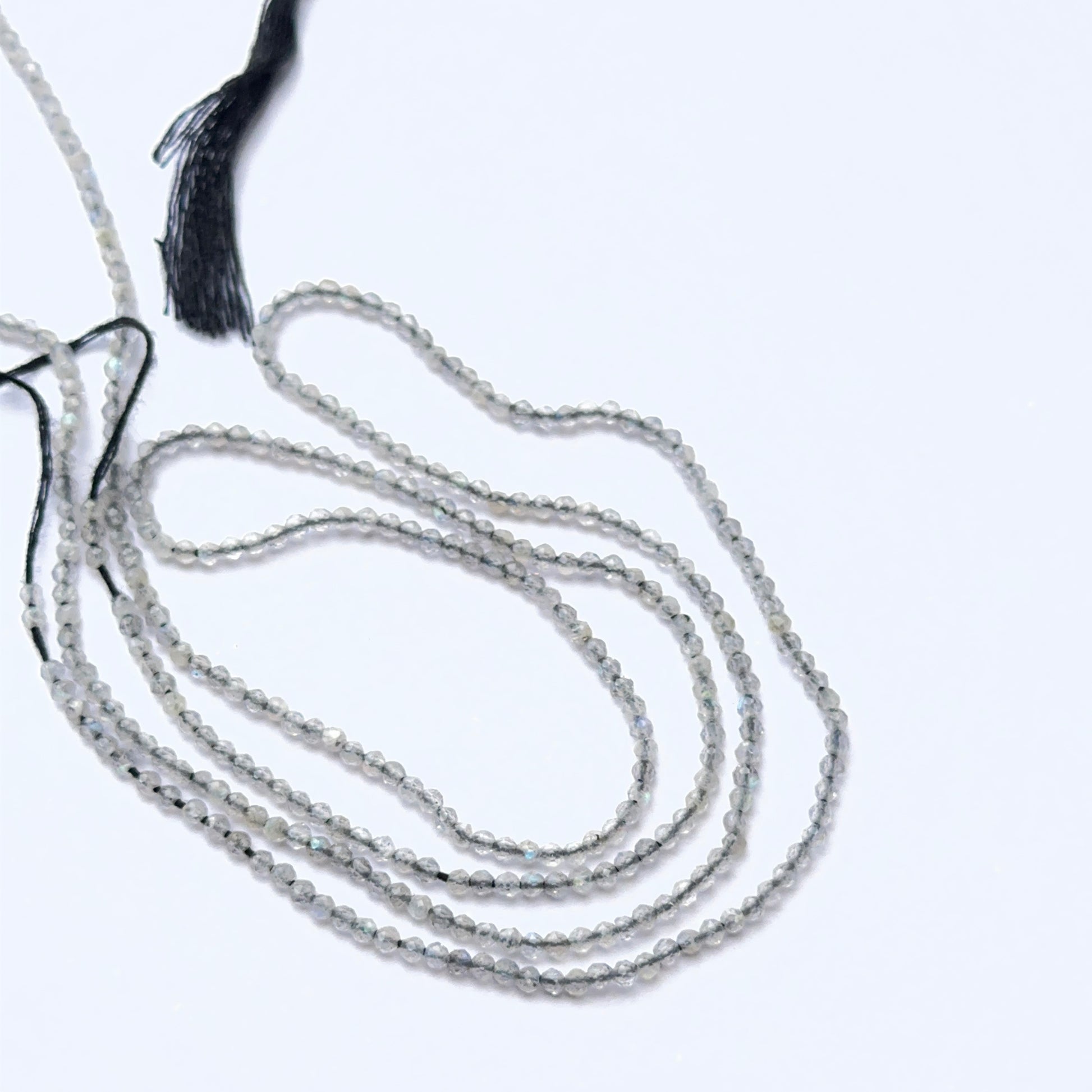 Soft‑hued Green Opal stone beads in faceted rondelle cut, displaying polished sparkle for jewellery designers.