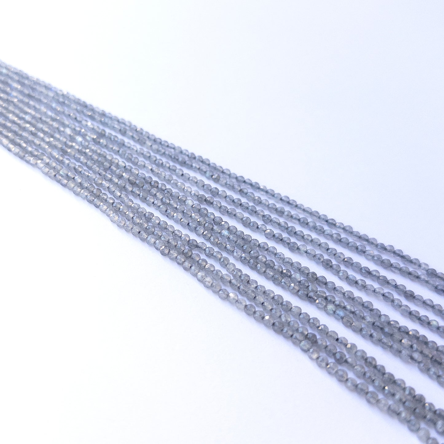Genuine Labradorite gemstone beads in faceted rondelle shape, displaying polish, shimmer, and natural beauty for jewellery crafting.