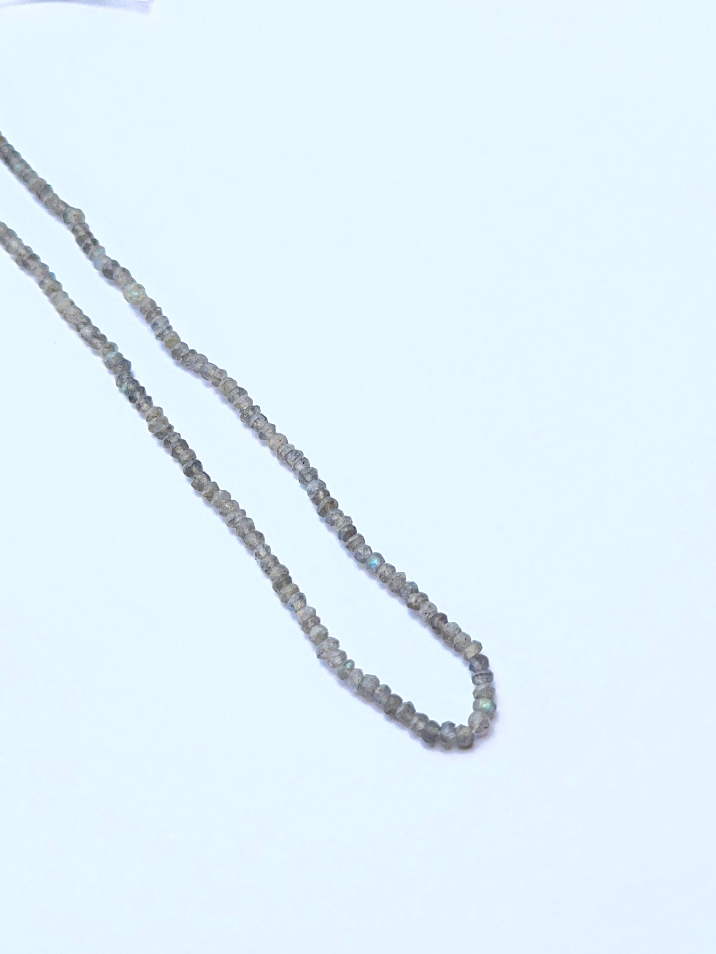 Labradorite natural gemstone beads in faceted rondelle shape, ideal for artisan jewellery and creative DIY beadwork.