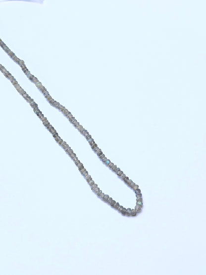 Labradorite natural gemstone beads in faceted rondelle shape, ideal for artisan jewellery and creative DIY beadwork.