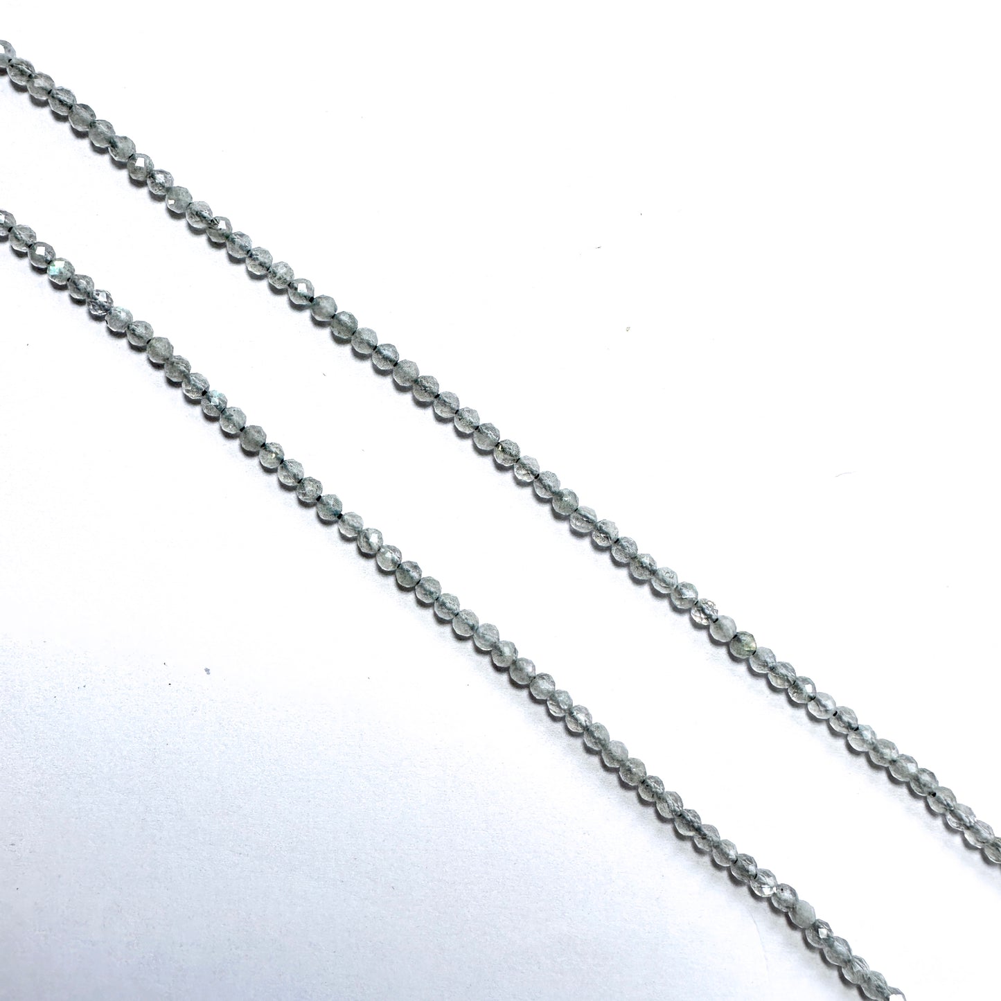 Handmade jewellery components with Labradorite beads arranged in a 32cm strand, ideal for elegant and versatile designs.