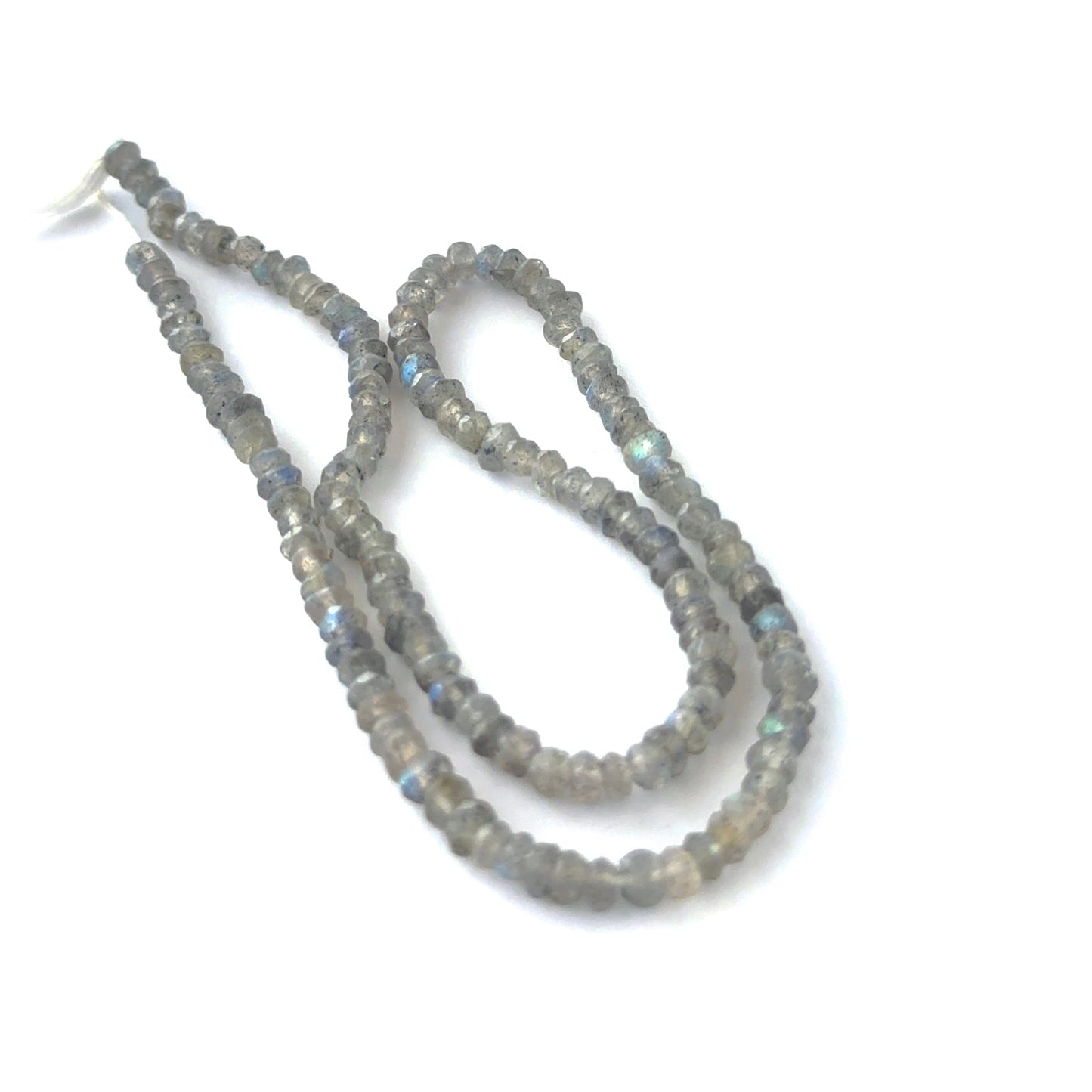 Labradorite faceted rondelle beads showing bright flashes of blue and green.