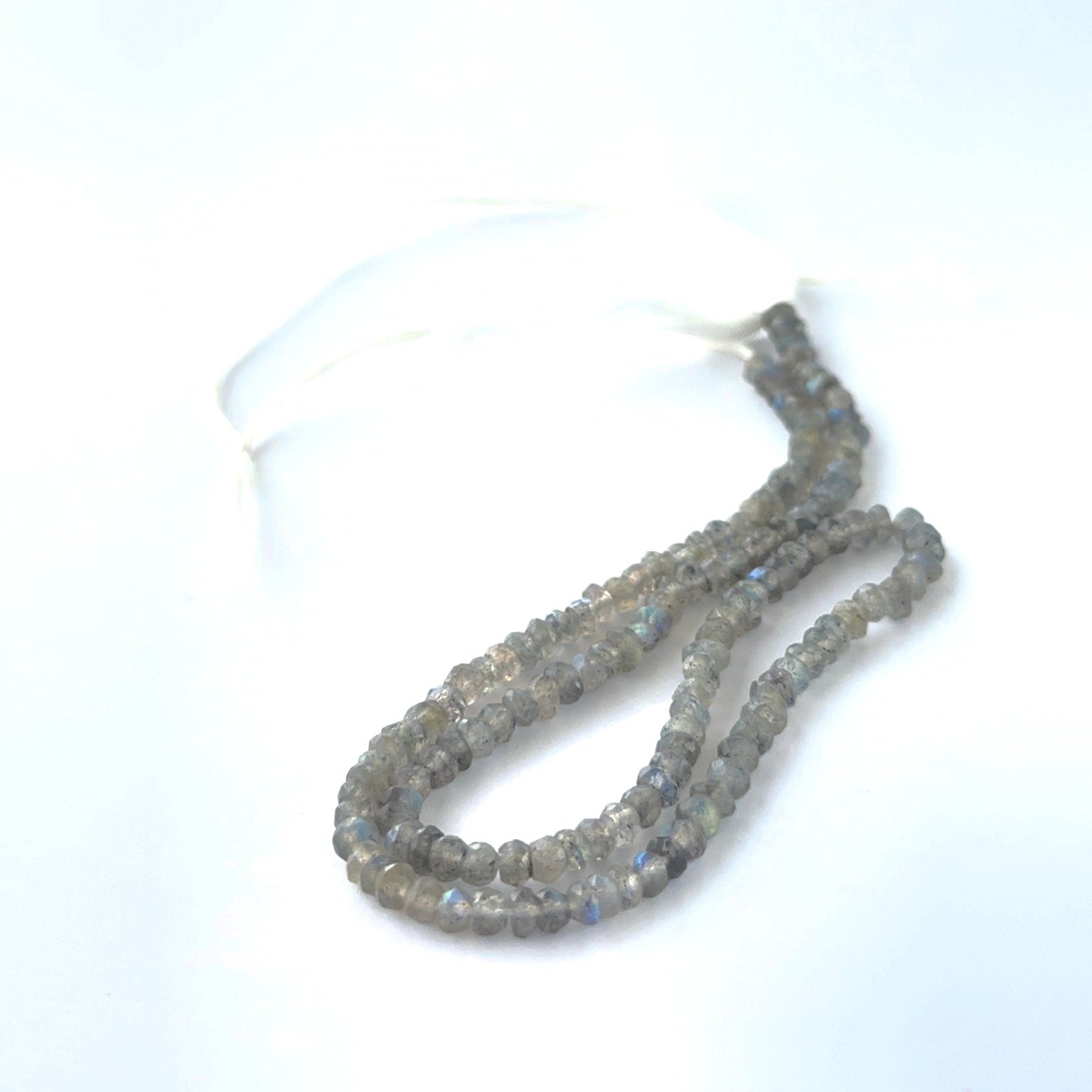 Close view of Labradorite faceted rondelles showing cut, clarity and premium gemstone quality