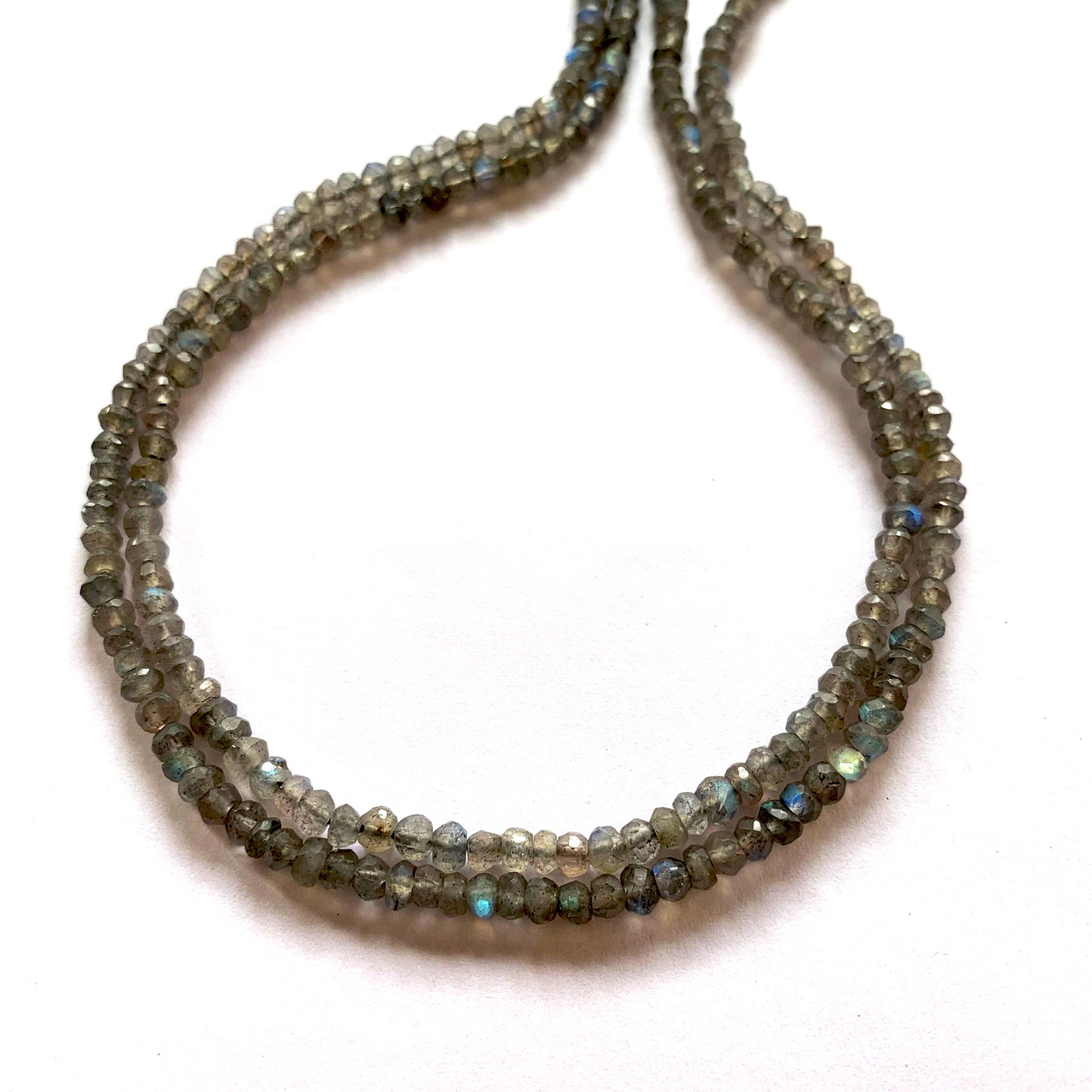 Shimmering Labradorite beads strung precisely on a 32cm strand, ideal for elegant jewellery.