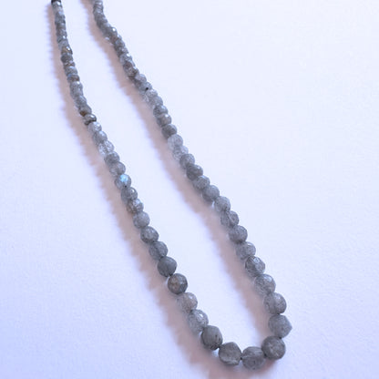 Natural gemstone beads featuring Labradorite with polished finish and shimmering colour play.