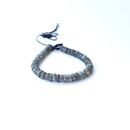 Strand of labradorite faceted rondelles displaying grey‑blue tones and quality cut for gemstone beads for DIY jewellery.