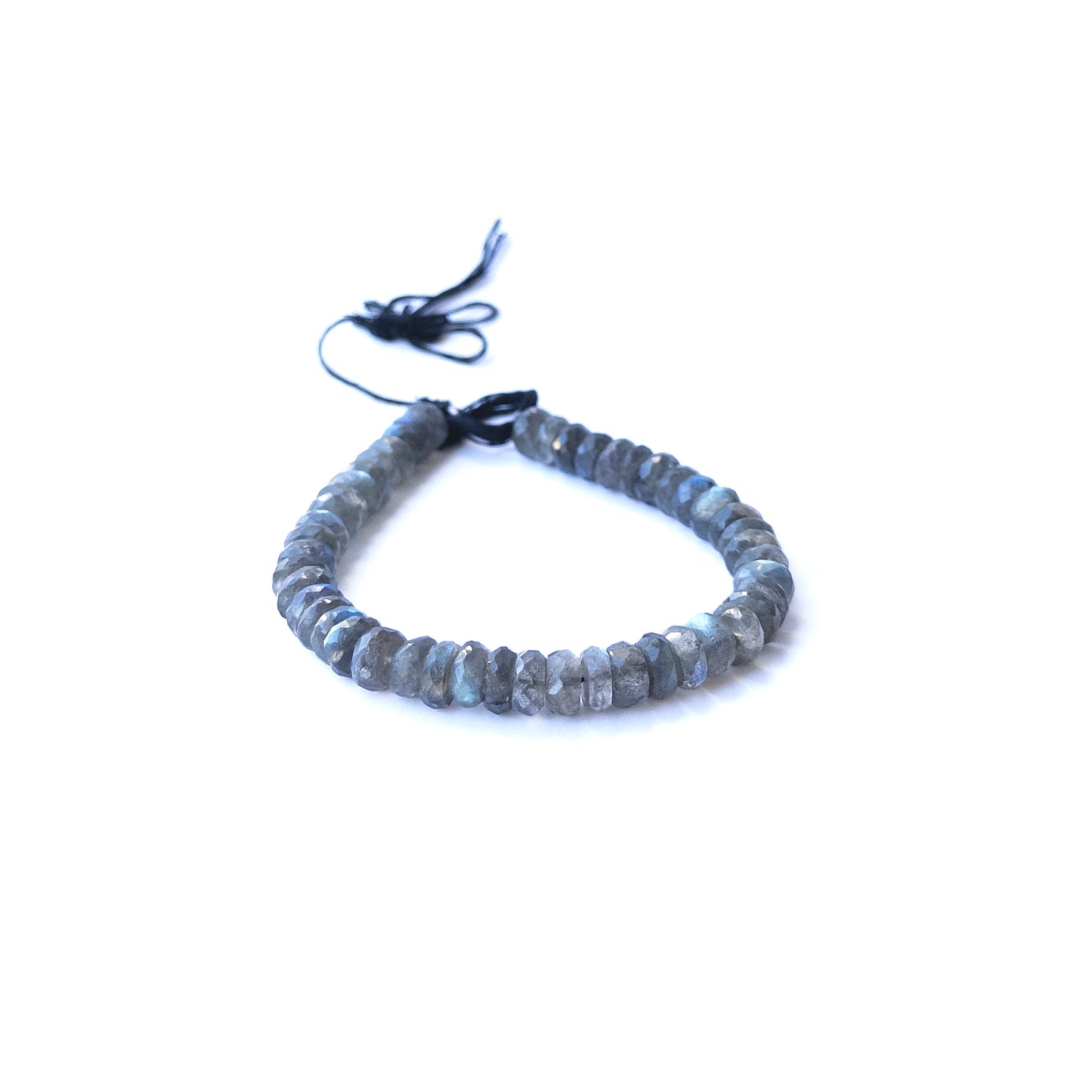 Labradorite faceted rondelle beads in 8.5–9mm size arranged in a strand, showing blue flashes for handmade jewellery components.