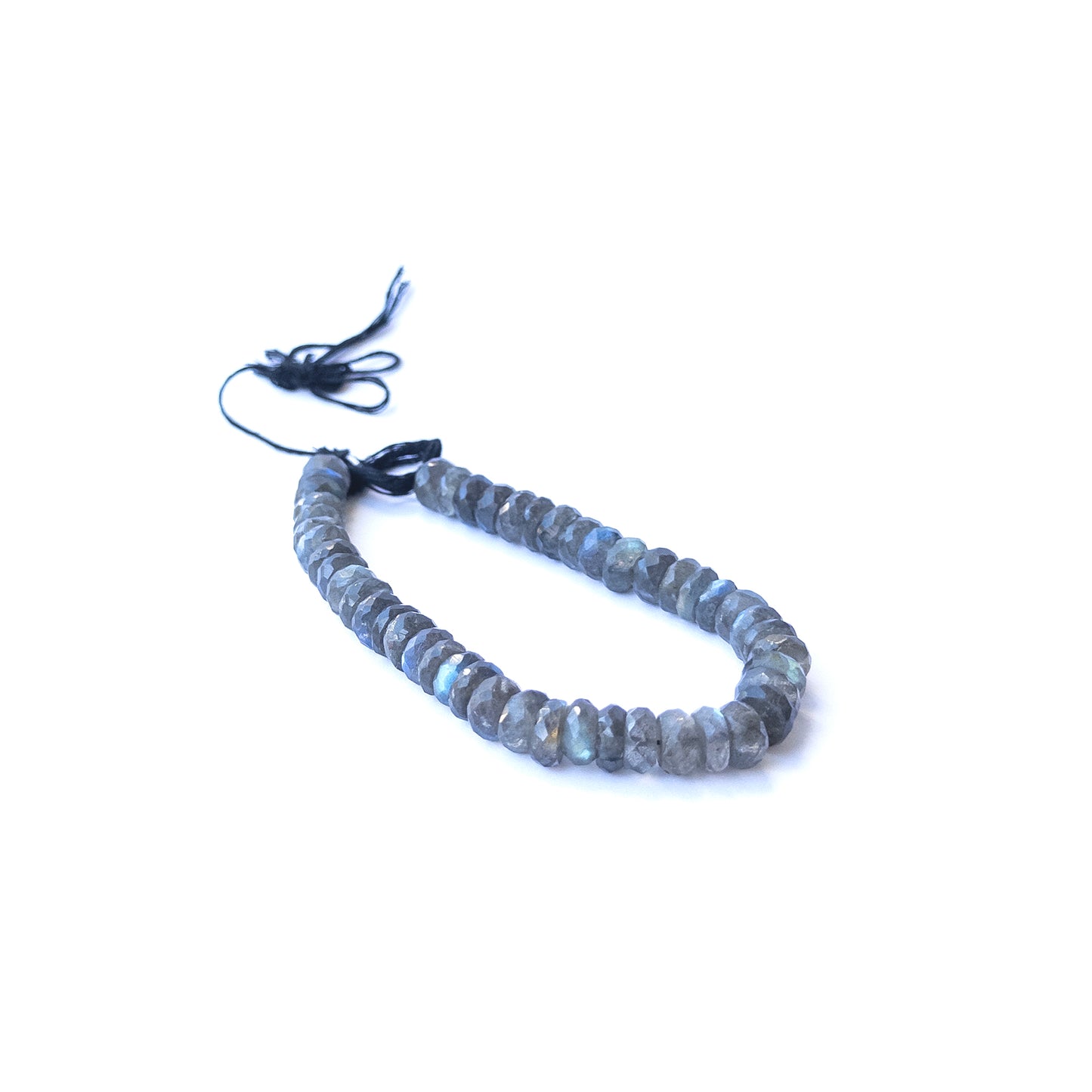 Close‑up of genuine labradorite faceted rondelle gemstone beads with natural shimmer for DIY jewellery making.