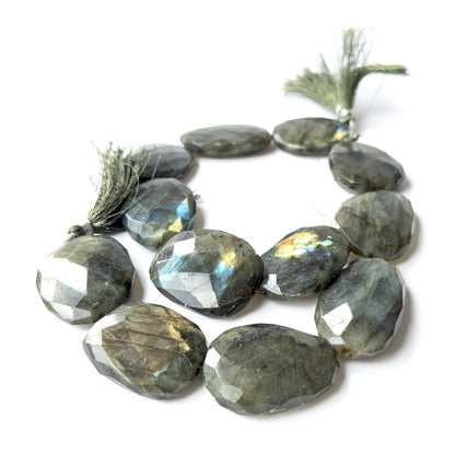 High‑quality Labradorite faceted oval beads showcasing bold proportions and vibrant colour play.
