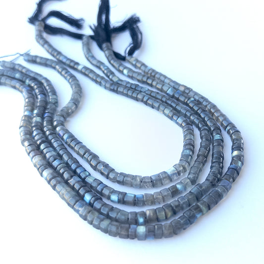 Natural Labradorite smooth cylinder stone beads 5.5–5.7mm displayed neatly for DIY jewellery and authentic gemstone designs.