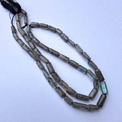  delicate strands of labradorite beads, showcasing their smooth design.
