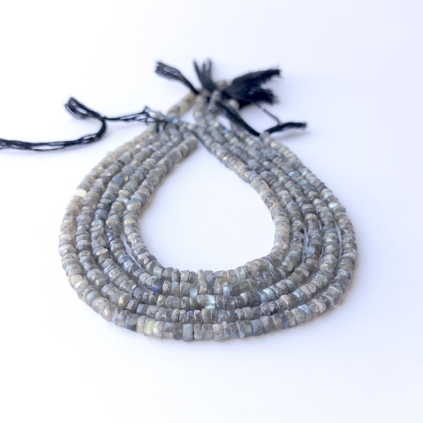 Labradorite smooth wheel beads in 5.3–5.6mm size, showcasing genuine gemstone shine for handmade jewellery.