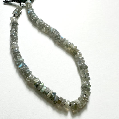 Natural gemstone beads for DIY jewellery featuring 6-6.2mm Labradorite wheels with polished finish and iridescent tones.