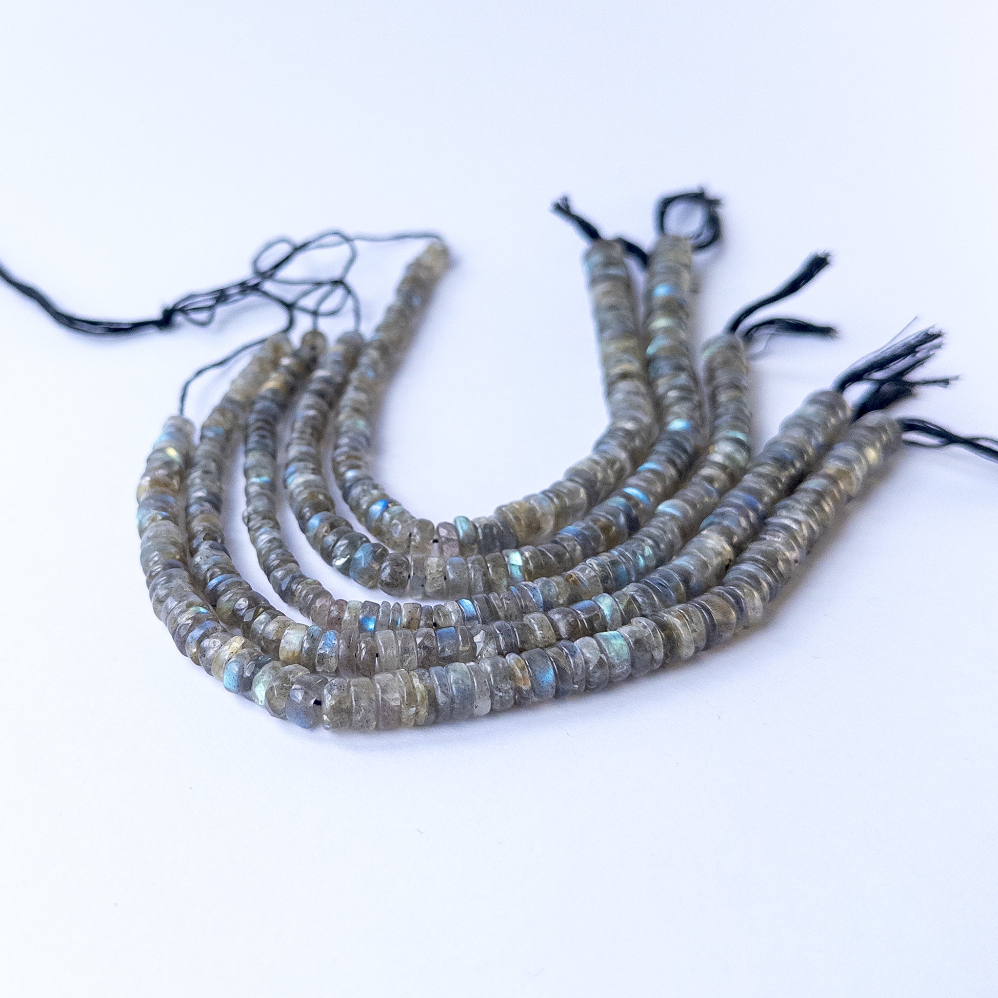 Genuine Labradorite stone beads in smooth wheel cut with blue‑grey flashes, ideal for DIY jewellery making.