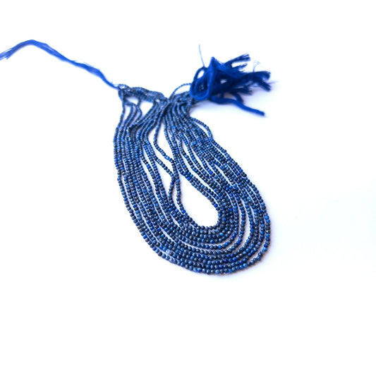 Authentic lapis lazuli stone beads in fine faceted rondelle cuts showing polished shine for jewellery design work.