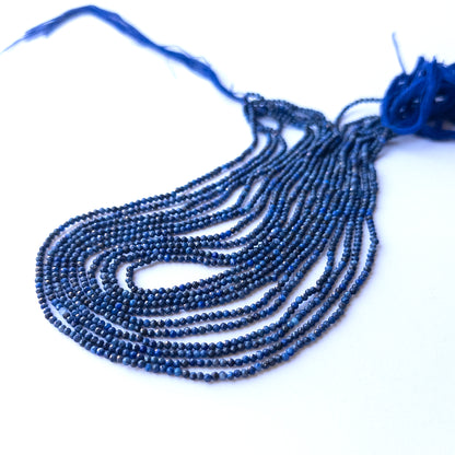 Detailed view of 3.2mm lapis lazuli rondelles with crisp faceting and smooth polish for handmade jewellery components.