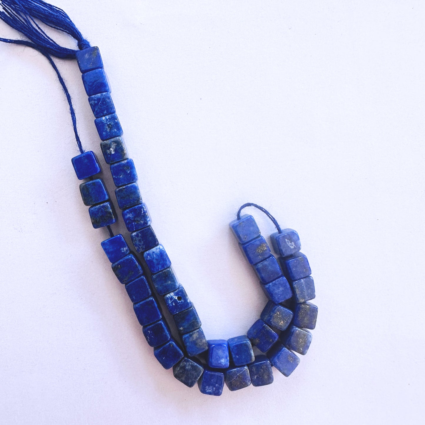 Lapis Lazuli smooth cube beads in 5mm size with golden flecks on a 20cm strand for elegant jewellery designs.