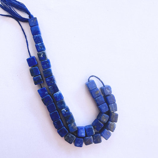 Lapis Lazuli smooth cube beads in 5mm size with golden flecks on a 20cm strand for elegant jewellery designs.