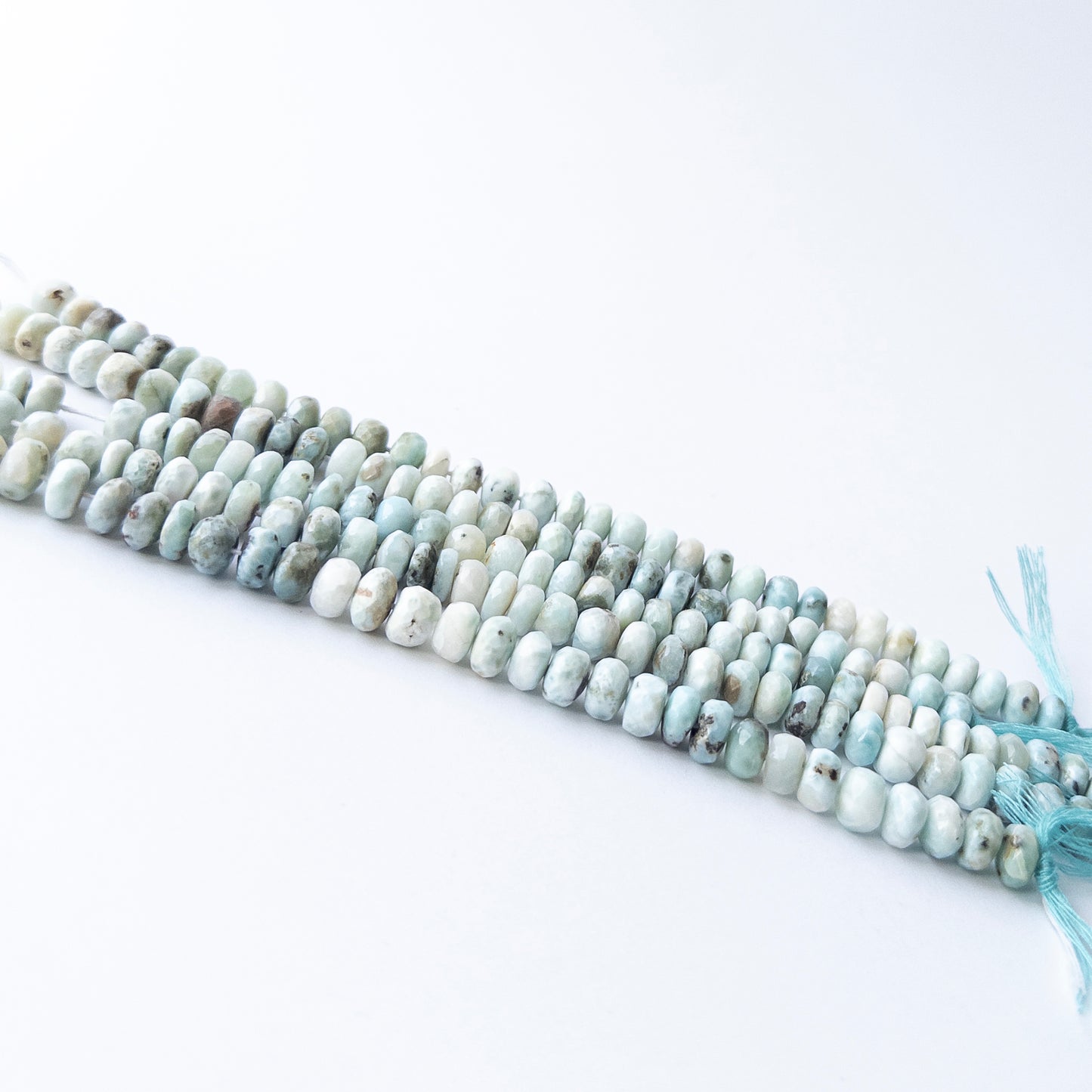 Authentic Larimar stone beads with faceted rondelle cut, ideal for DIY jewellery makers seeking premium gemstone components.
