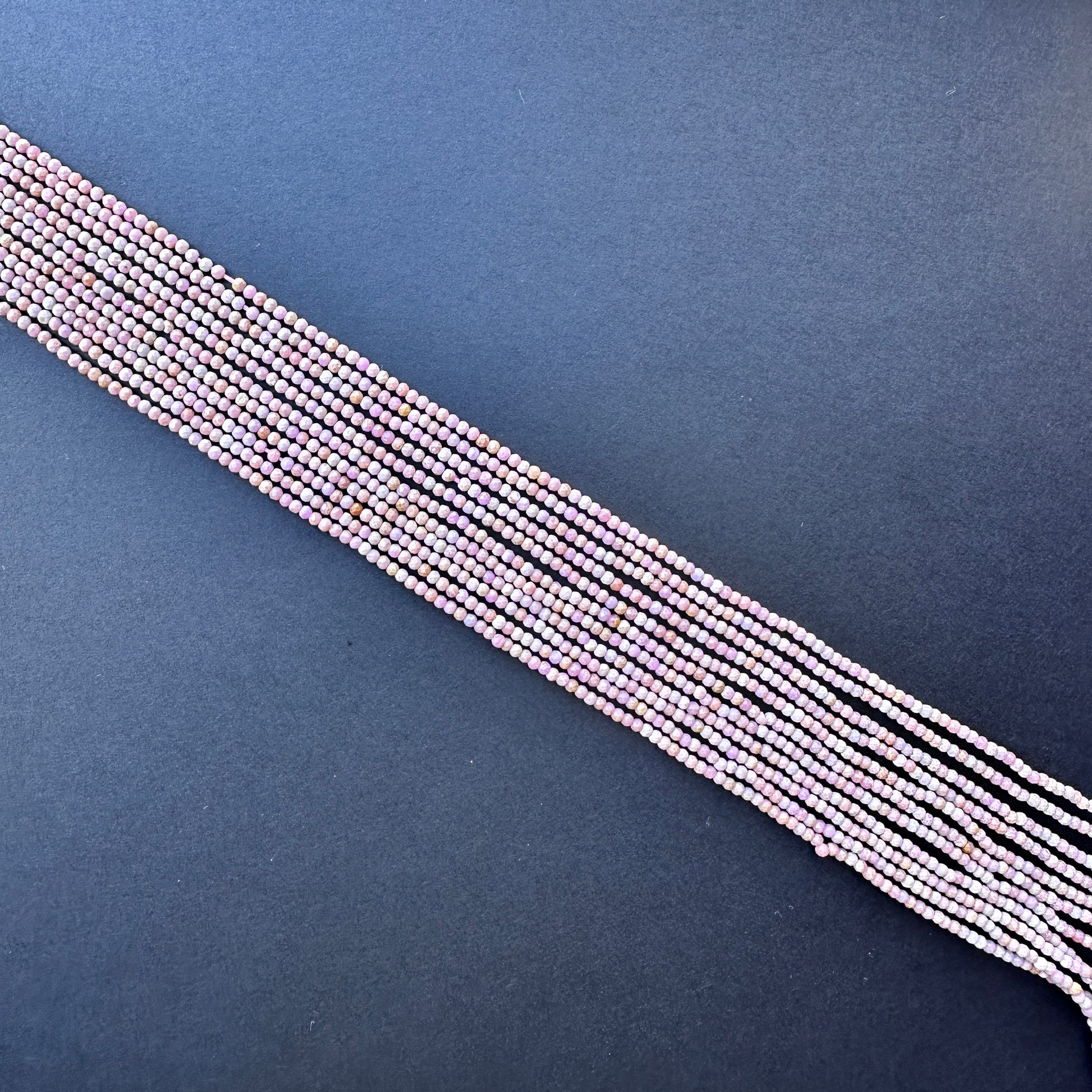 High-quality Lavender Opal beads with subtle lavender tones and sparkling facets, strung in a 32cm strand.