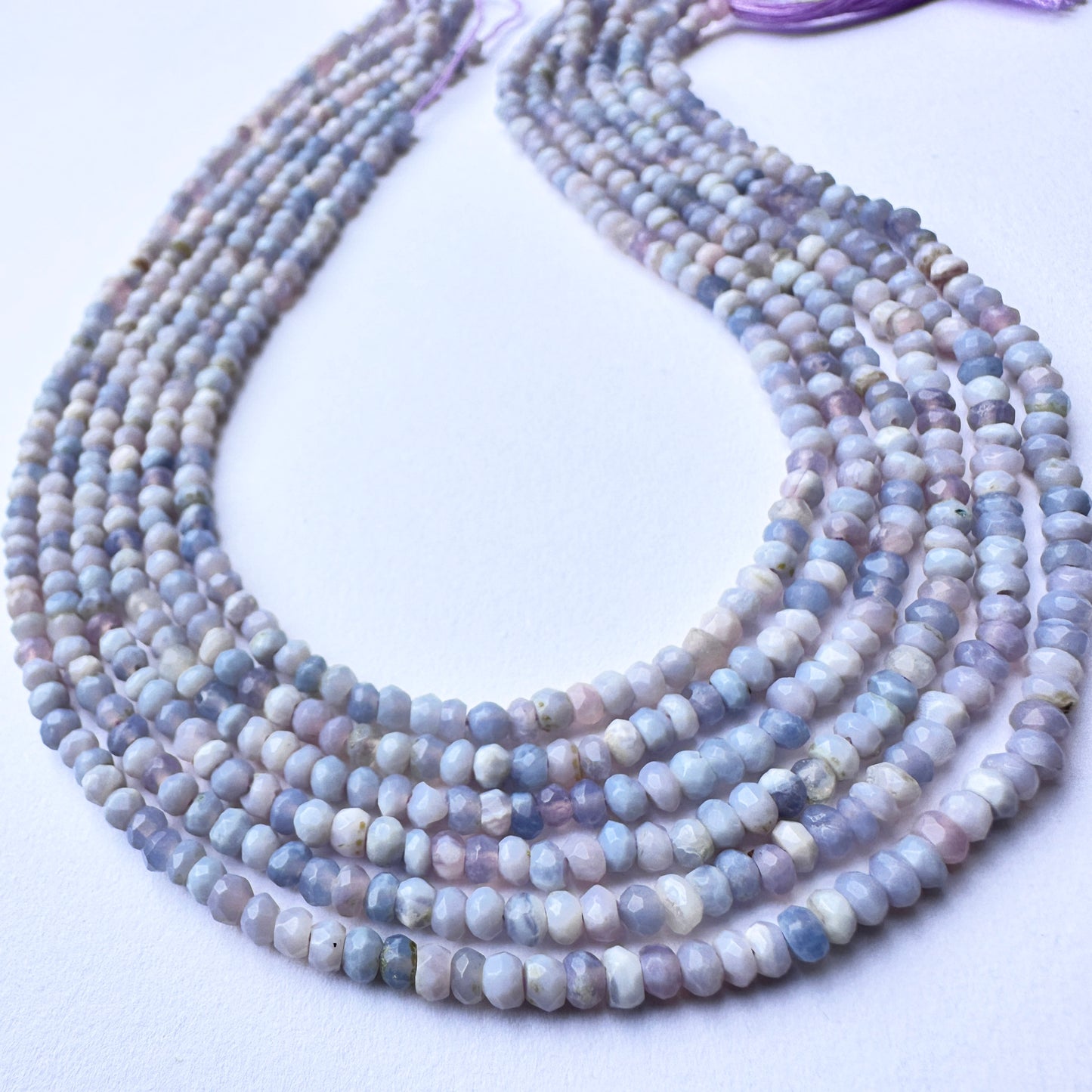 Natural gemstone beads in lavender opal with glossy finish and consistent sizing for DIY jewellery making.