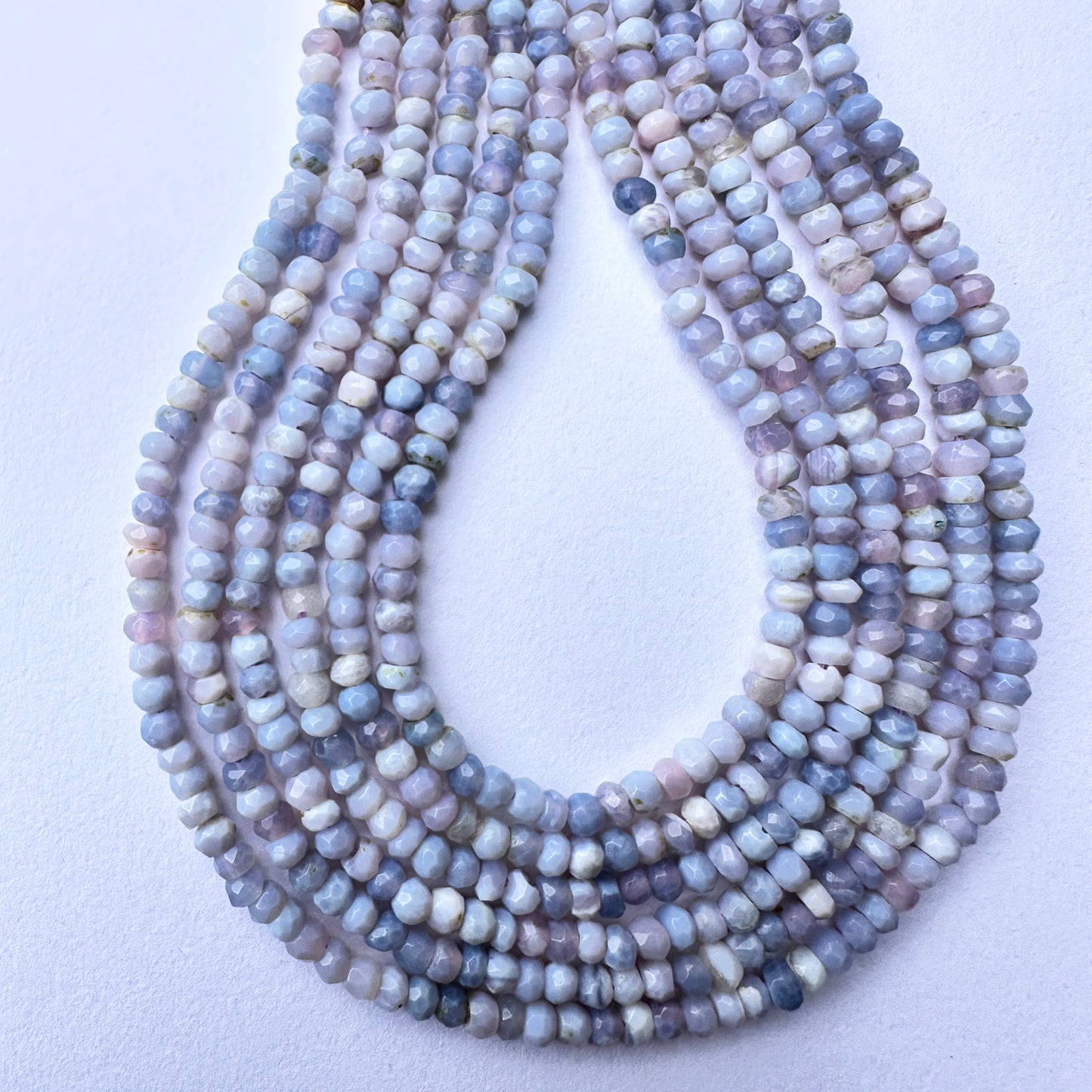 Handmade jewellery components featuring faceted lavender opal beads with delicate shine and premium quality.