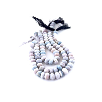 Lavender Opal faceted rondelle beads sized 7.5–8mm arranged in a 15cm strand, showing soft lavender tones and sparkling facets.