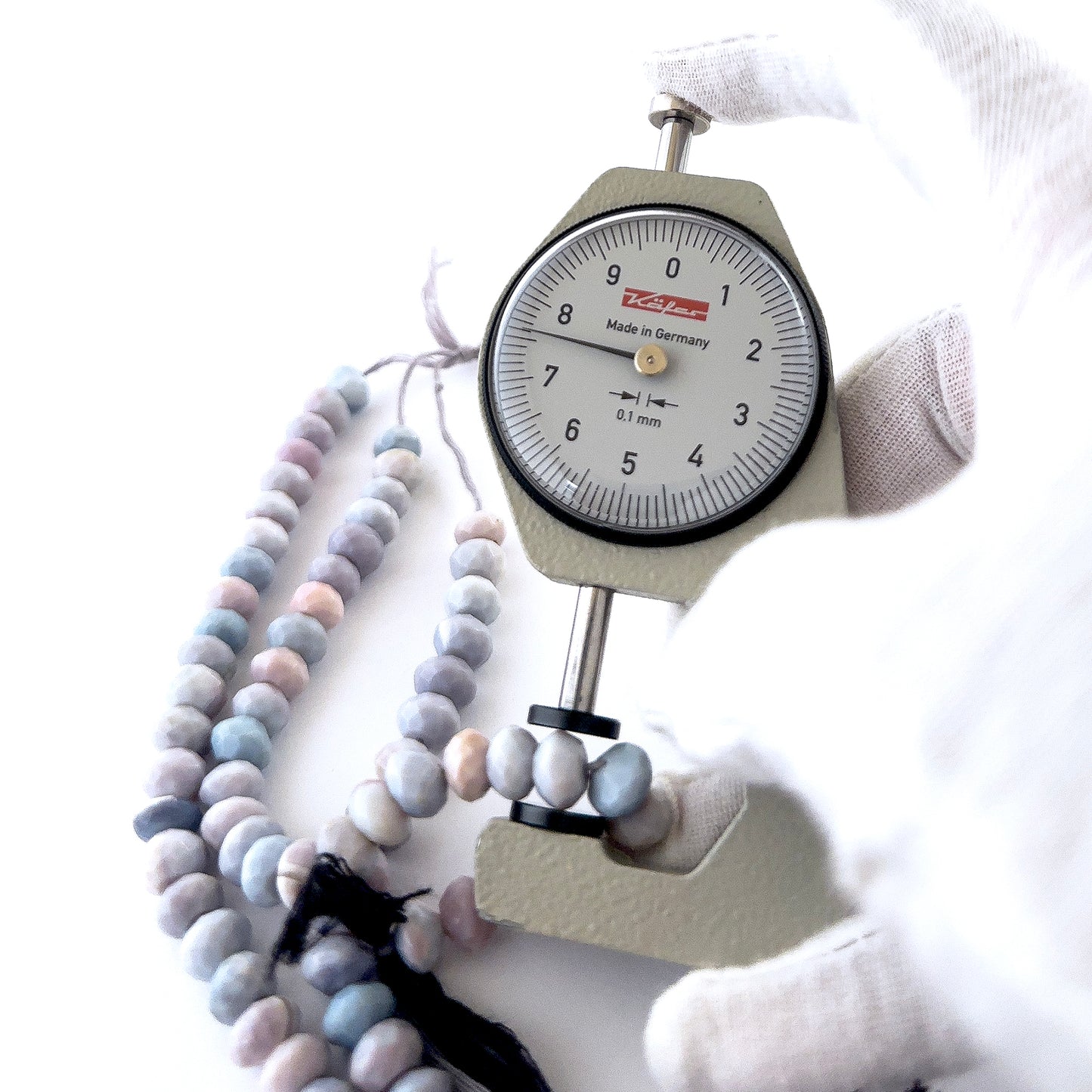 Lavender Opal rondelle beads featuring crisp faceting and gentle lilac hues in consistent 7.5–8mm sizing.