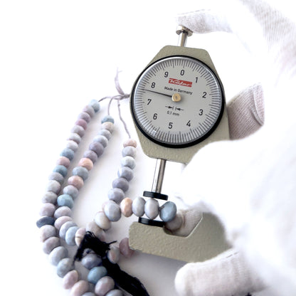 Lavender Opal rondelle beads featuring crisp faceting and gentle lilac hues in consistent 7.5–8mm sizing.