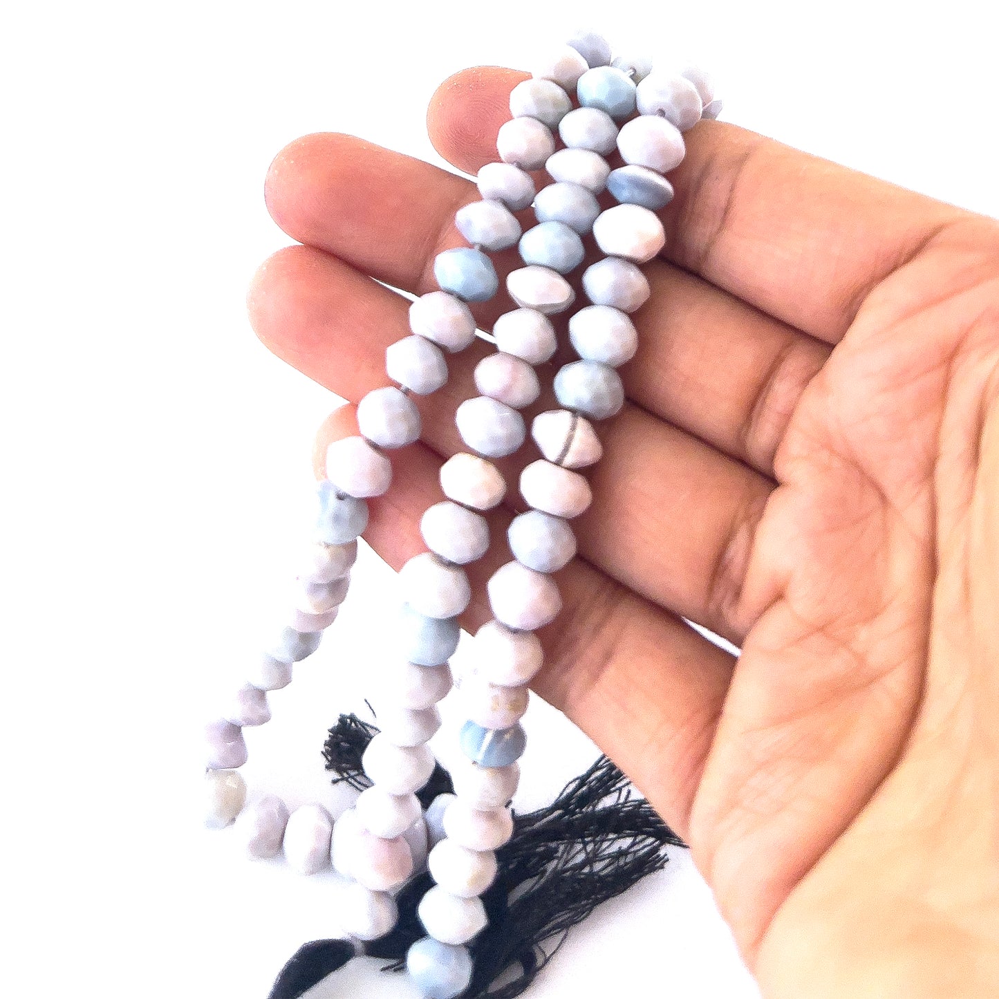 Lavender Opal gemstones in faceted rondelle form, offering bright reflective shine and smooth pastel colouring.