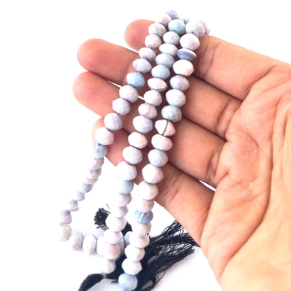 Lavender Opal gemstones in faceted rondelle form, offering bright reflective shine and smooth pastel colouring.