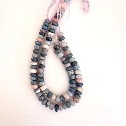 A string of polished Lavender Opal rondelle beads with soft lilac hues and glossy finish.